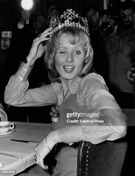 Belinda Green, Miss Australia and the newly crowned Miss World, facing the photographers at a London hotel.