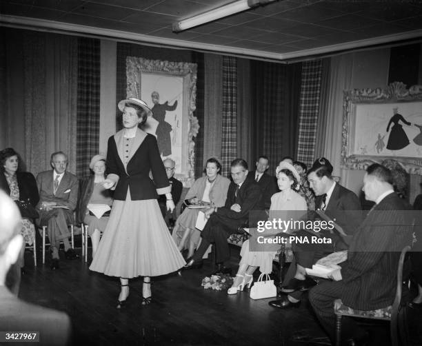 Princess Elizabeth attends a fashion parade at the International Wool Secretariat Exhibition at Dorland House, Lower Regent Street in London.