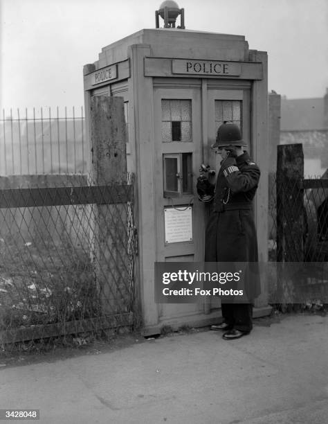 Metropolitan police emergency telephone box for public use at Richmond in London.