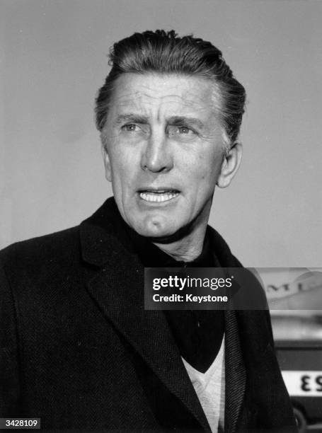 Film Star Kirk Douglas in Rome airport on his way to a safari in Kenya.