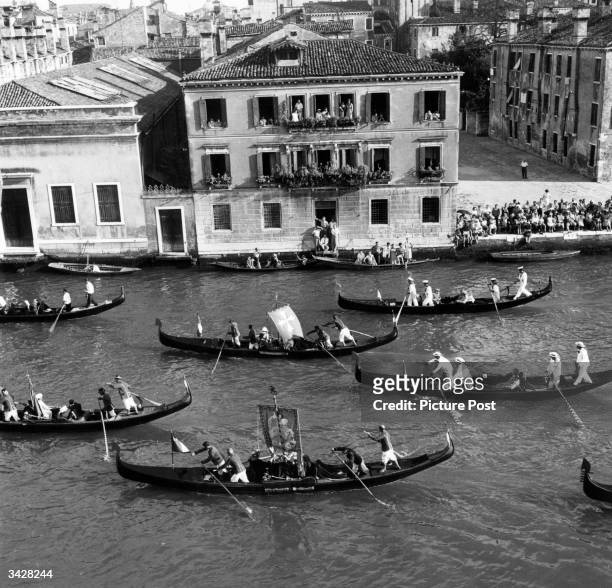 Regatta in the grand canal at Venice. Original Publication: Picture Post - 5402 - Venice Canal Party - pub. 1951