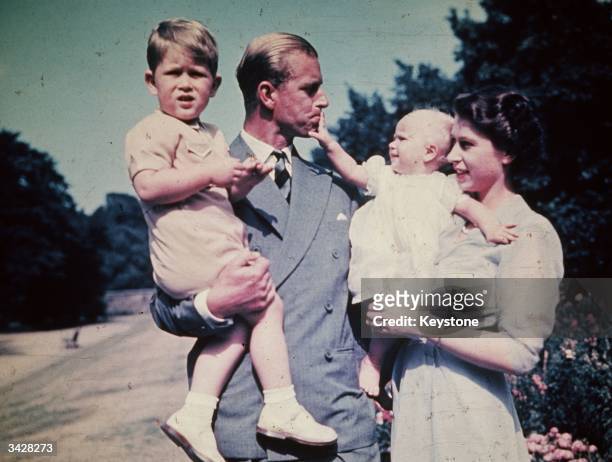 Princess Elizabeth with her husband Prince Philip, Duke of Edinburgh, and their children Prince Charles and Princess Anne, August 1951.