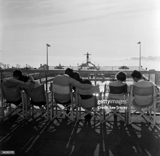 Honeymooning couples by the pool at Billy Butlin's Ocean Hotel in Saltdean near Brighton in Sussex.