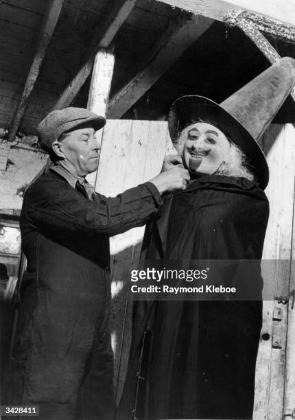Man dresses up a dummy Guy Fawkes in preparation for Bonfire Night in the East Susses town of Lewes. Original Publication: Picture Post - 5463 -...