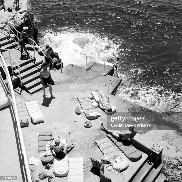 Holidaymakers relax at Hotel du Cap at Eden Rock in Cap Ferrat near Nice.