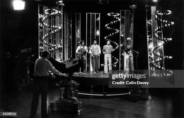 Pop group, 'The Real Thing' with lead singer Eddie Amoo performing in the BBC programme, 'Top of the Pops'.