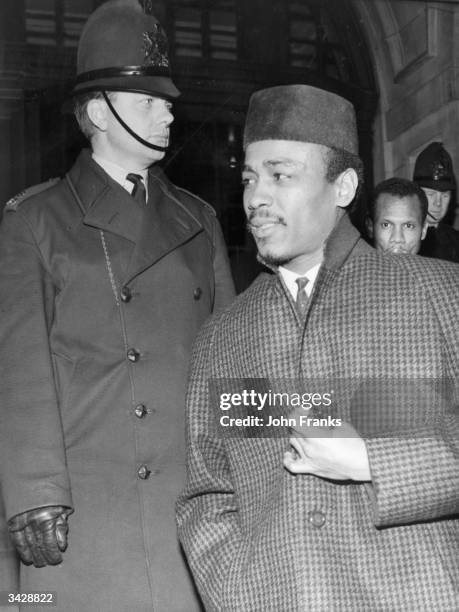 Aloysius 'Lucky' Gordon arrives at the Old Bailey in London after being accused of assaulting his former girlfriend, good-time girl Christine Keeler.