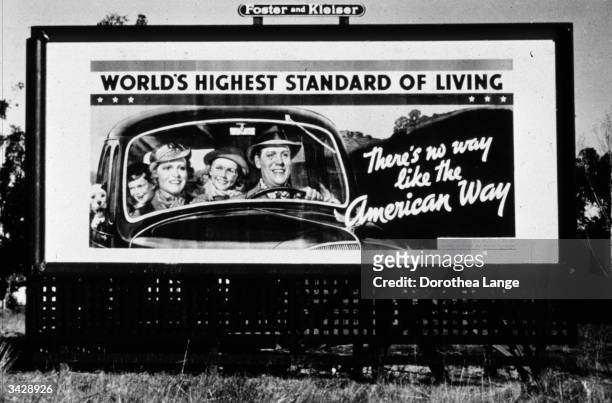 Billboard, sponsored by the National Association of Manufacturers, on Highway 99 in California during the Depression. It reads 'There's no way like...