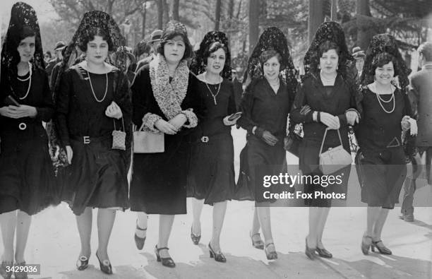 Spanish women wearing mantillas.