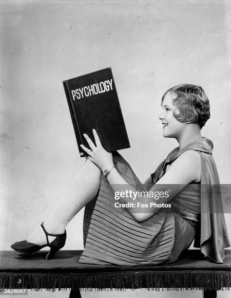 Film actress Helen Ruth Mann reads a hefty book on Psychology.