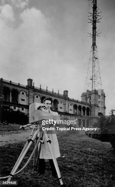 Birkinshaw operating the Marconi-EMI instantaneous TV camera transmitting the view from Alexandra Palace, the BBC's first high definition TV station....