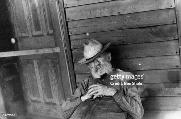 An inhabitant of Hooverville in Circleville, Ohio. Hooverville is a camp for displaced persons named after the American President Herbert Hoover who...