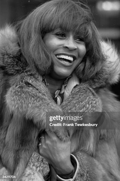 Rock star Tina Turner wrapped in furs as she arrives at Heathrow airport. She is in the UK to give two concerts.