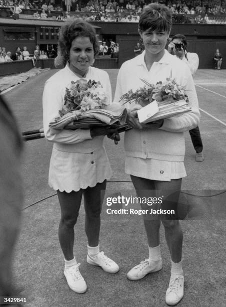 Nineteen year old Evonne Goolagong from Australia with her compatriot Margaret Court before their singles final at Wimbledon which Evonne won 6-4,...