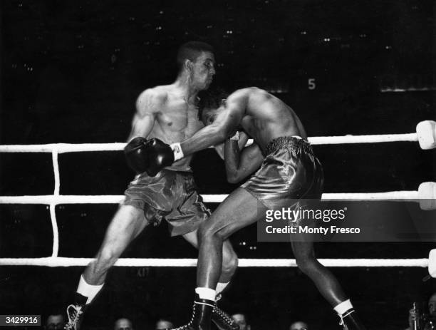 Sugar Ray Robinson and Randolph Turpin, during their World Middleweight title fight which Turpin won on points.
