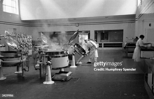 Technicians at work in the ?1 000 Hospital Centre in Birmingham, the first of its kind. The 150 acres on which the centre stands were donated by the...