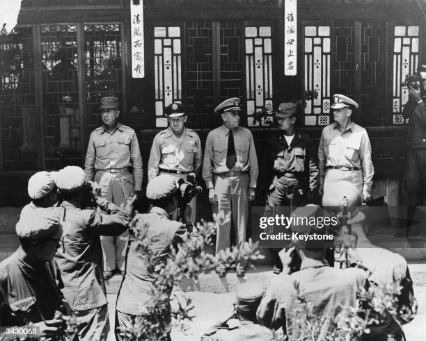 From left to right, Major General Henry I Hodes of the 8th Army, Major General L C Craigie , Vice Admiral Turner Joy , the chief UN delegate, Major...