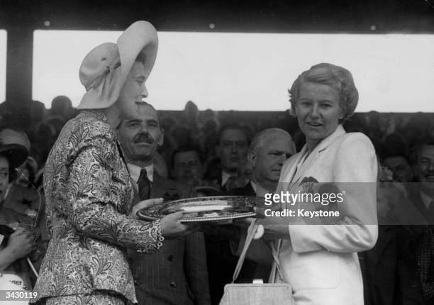 The Duchess of Kent presenting the trophy for winning the Ladies' Singles at Wimbledon to Louise Brough of America.