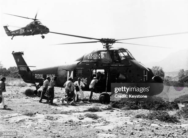 Royal Navy Wessex helicopter of 845 NAS picking up evacuees near Kyrenia in Cyprus during the civil war between Greek and Turkish Cypriots.