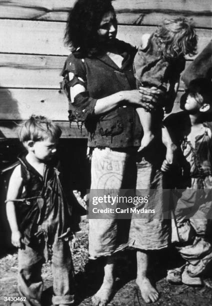 Mother and three of her children who are living in a field alongside Highway 70 in Tennessee.