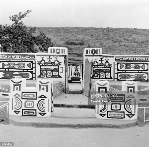 Ndebele women decorate their houses and compound walls with intricate and geometric patterns.
