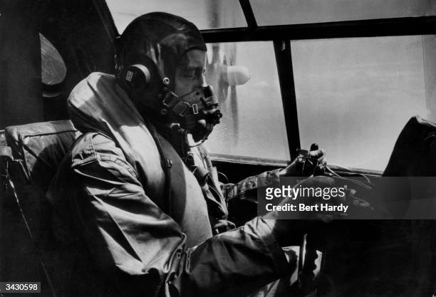 Pilot in a Sunderland bomber, which will take part in an exercise attack on the liner 'Queen Elizabeth'. Original Publication: Picture Post - 4562 -...