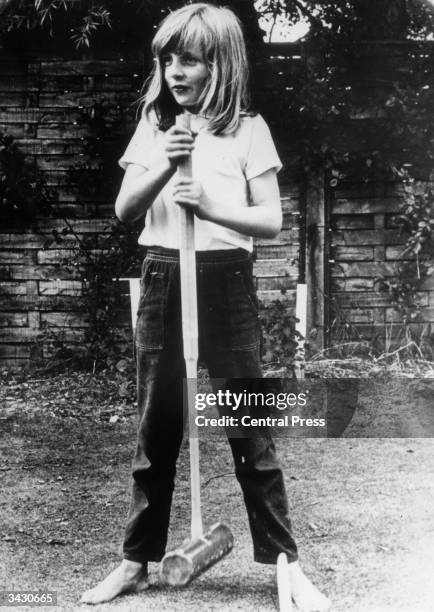 Lady Diana Spencer holding a croquet mallet during a game at Itchenor, West Sussex.