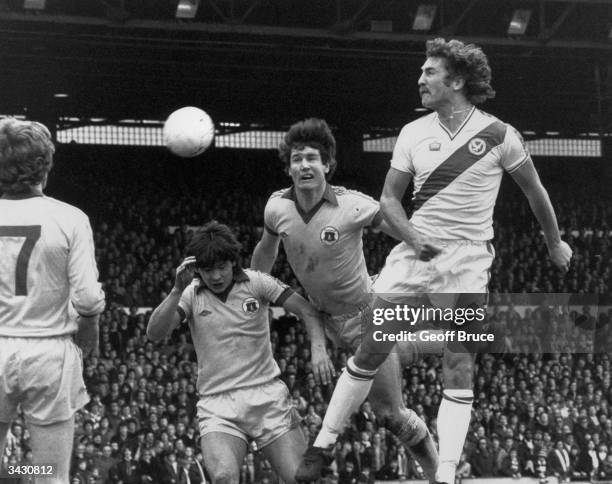 Everton footballers Billy Wright and Mick Lyons challenge Jim Cannon of Crystal Palace for the ball during a first division match at Selhurst Park.