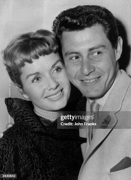 American singing star Eddie Fisher and his wife, film star Debbie Reynolds at a press reception. Eddie Fisher is to appear at the London Palladium in...