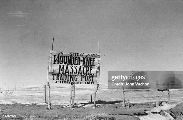 Sign at the site of the Wounded Knee Massacre, South Dakota, where 250 American Indians were killed in 1890.