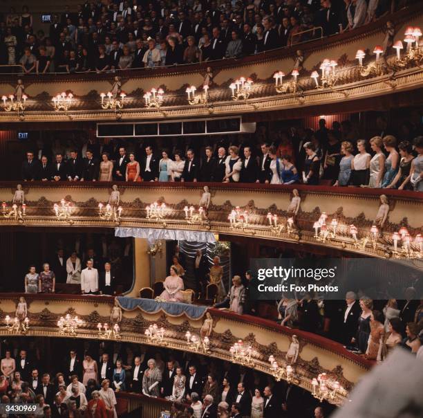 The crowd rises for the Queen Mother as she attends a Royal Gala Performance of Mozart's 'The Marriage of Figaro' at the Covent Garden Opera House,...