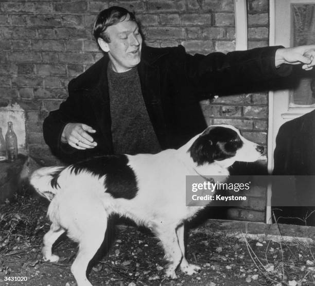 David Corbett with his dog, Pickles, who found the World Cup in his back garden after it was stolen before the World Cup in England eight days...