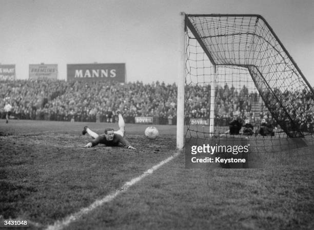 Manchester United goalkeeper, Harry Gregg, fails to stop Fulham's second goal at Craven Cottage, London.