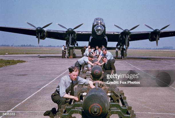 Bombs being loaded onto a British Airforce AVRO Lancaster Bomber during World War II, 3rd September 1942.