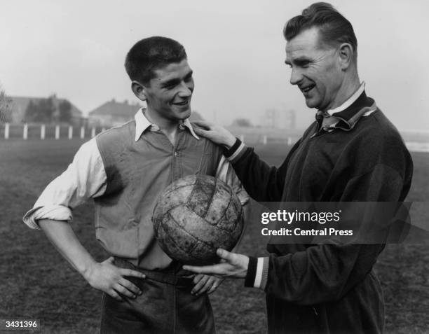 Peter Doherty, the trainer of the Irish football team talking to Johnny Crossan who was banned for life by the Irish Football League but went on to...
