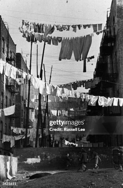 Lines of laundry drying between apartments on 138th and 139th streets in the Bronx, New York.