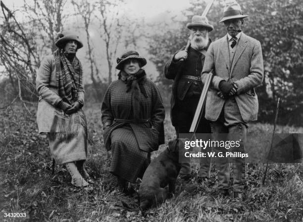 Captain and Mrs G Gill with Lady Murray at a pheasant shoot at Wrest Park, Ampthill, attended by a gamekeeper. Gaiters are a fashion wear for the...