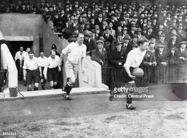 Wadsworth, of Huddersfield Town, leads out his England team mates onto the pitch as England play Wales.