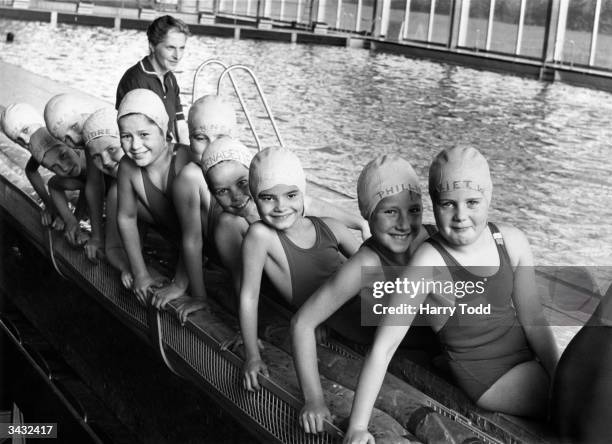 Pupils at the Virgo Fidelis Convent School having a swimming lesson at Crystal Palace Recreation Centre wth their names marked on the swimming caps...