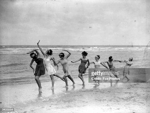 Morris dancers exercising on the sands at Saint-Idesbald.