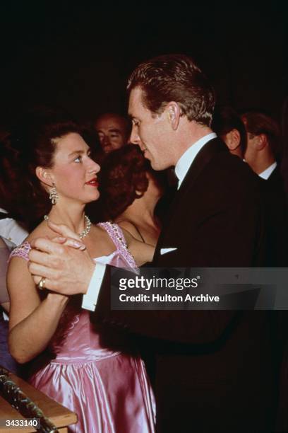 Princess Margaret dancing with her husband Lord Snowdon at a Dockland Ball in the Savoy Hotel.