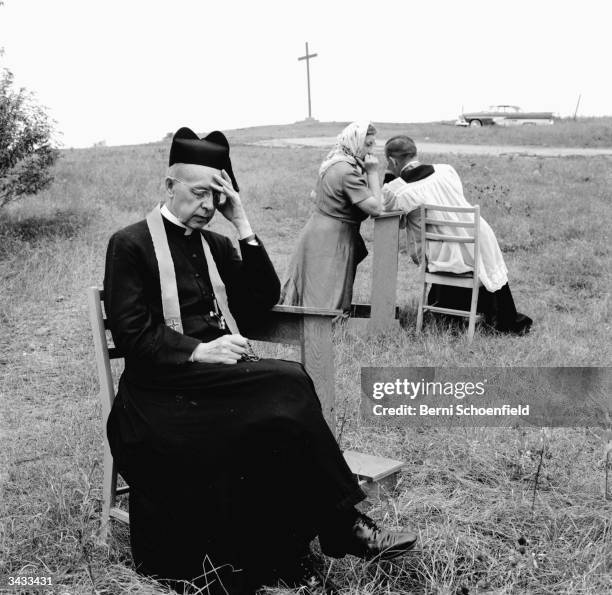 Jesuit priests hear confessions at the Martyr's Shrine, near Midland, Ontario. The shrine is dedicated to the first Jesuit missionaries who arrived...