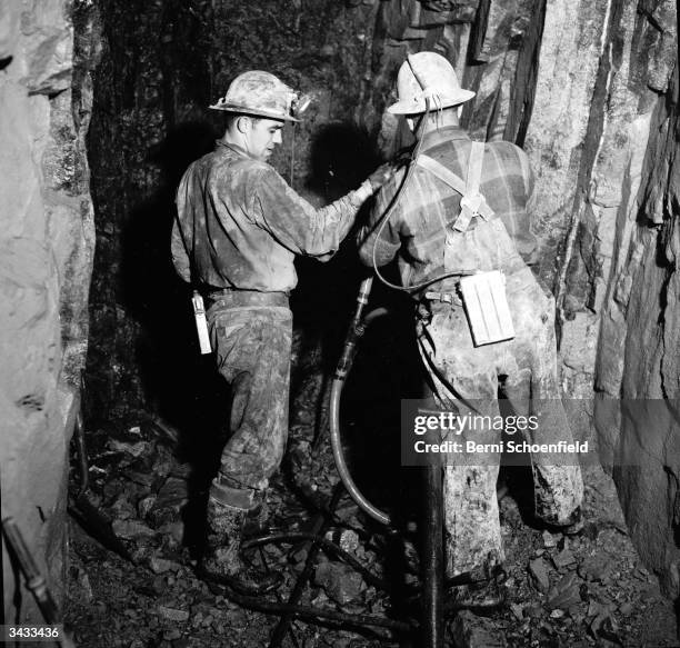 Miners drilling in silver mines in the revitalised town of Cobalt, Ontario.