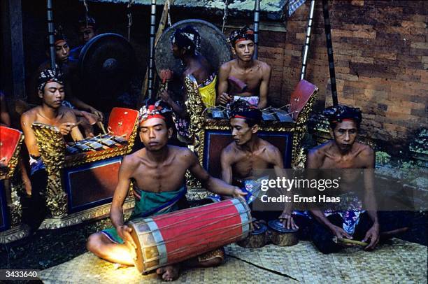 Balinese musicians play percussion.