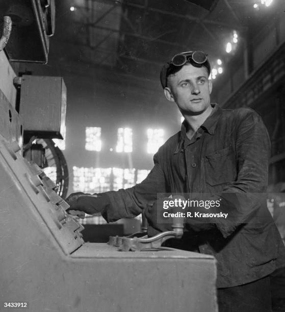 Russian steelworker Dmitri Galushko mans the control desk of an electrical furnace at the Dneprospetstal mills in Zaporozhye. He has recently been...