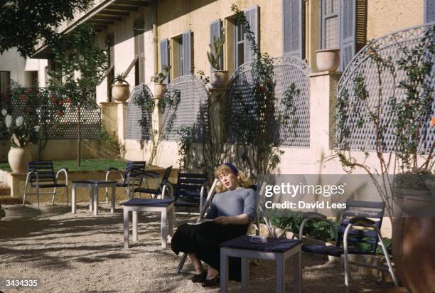 Roberta Cowell resting outside her hotel in the south of France. Roberta was once a Spitfire pilot, prisoner-of-war, racing motorist,and has...