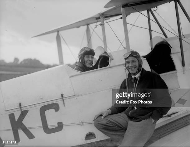 British aviatrix Amy Johnson with Captain Baker at Heston Aerodrome.