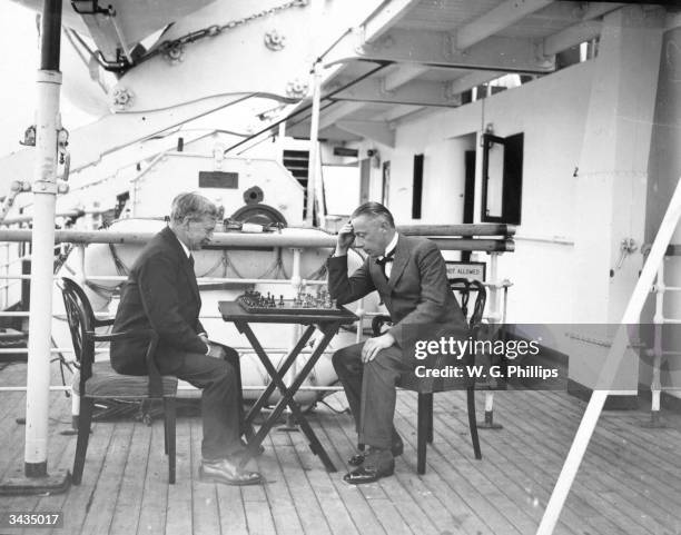 Tournament chess match takes place between Captain A Lowther of the Imperial Chess Club and Mr A T Waine of Lord Kylsant's group on the deck of the...