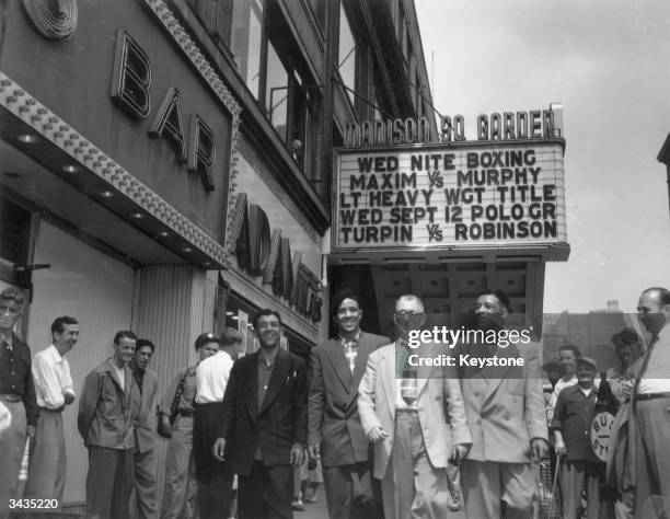 British boxer and World Middleweight Champion Randolph Turpin, with his manager and brothers, Dick and Jackie, in New York.