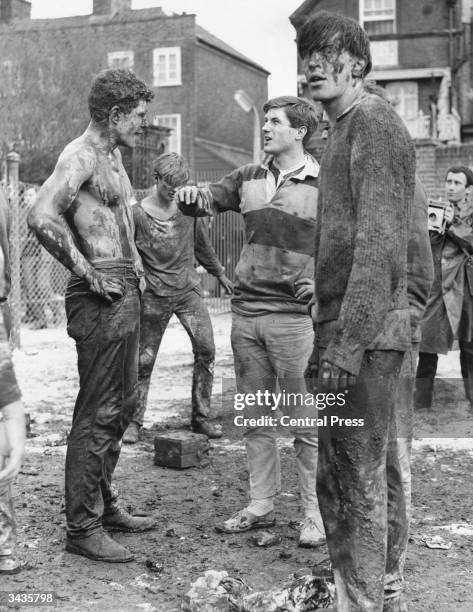 Trainee doctors covered in mud during pre-match fun before the final of the Hospital's Cup Match between students from Guy's Hospital and St...